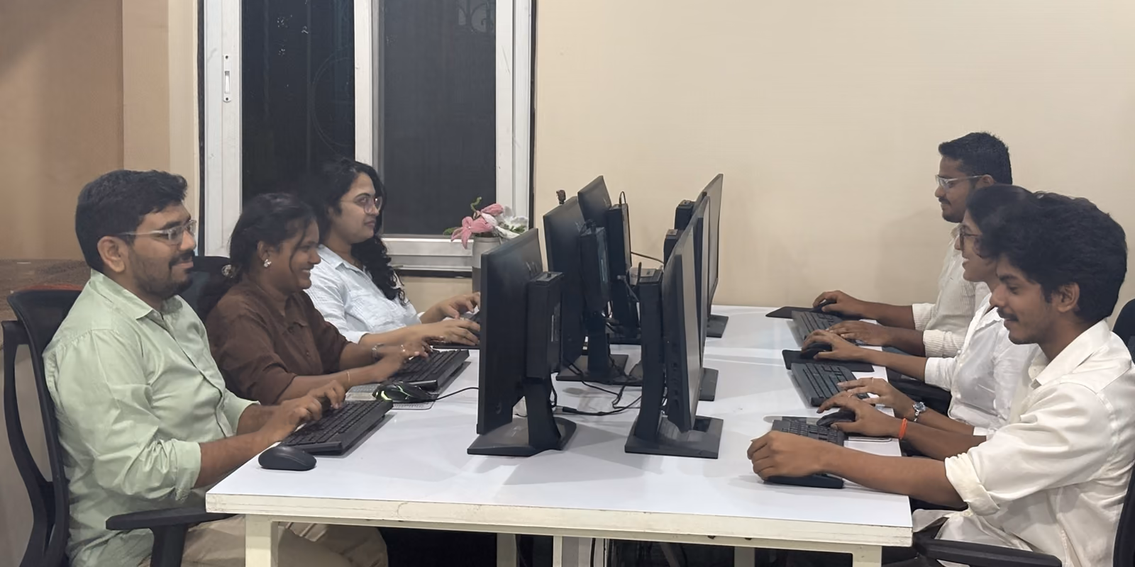 The Growww Tech team at their desks in our Visakhapatnam office